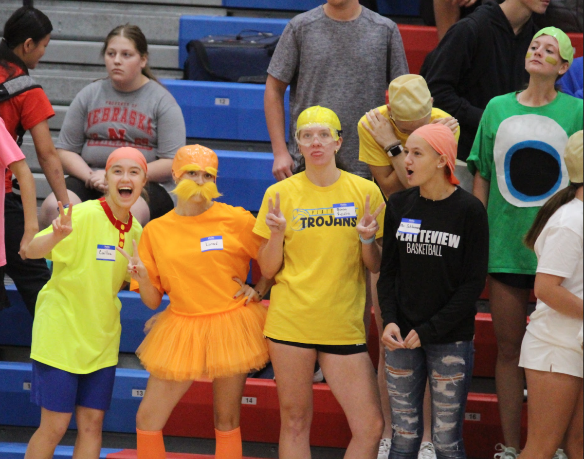 Macy Czech (12), Kate Martin (12), and Cass Coenen (12) dress up as famous bald characters for the HOCO dodgeball game.